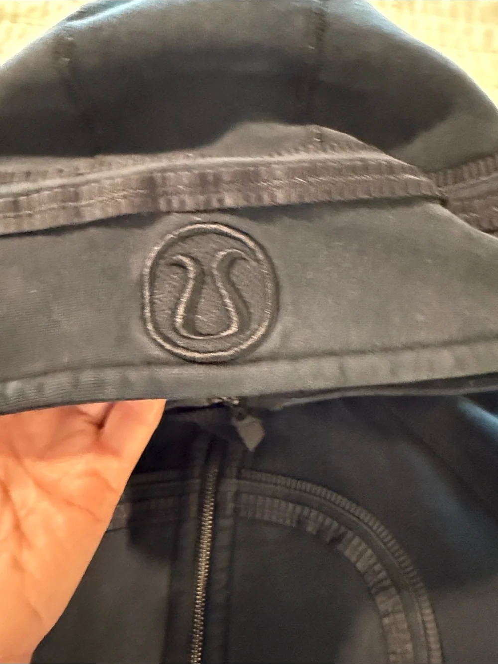 lululemon athletica. Special edition.  black jacket with ruffle trim and hood.